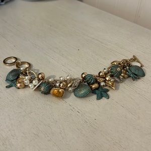Vintage designer unmarked seashell ab glass crystal charm bracelet